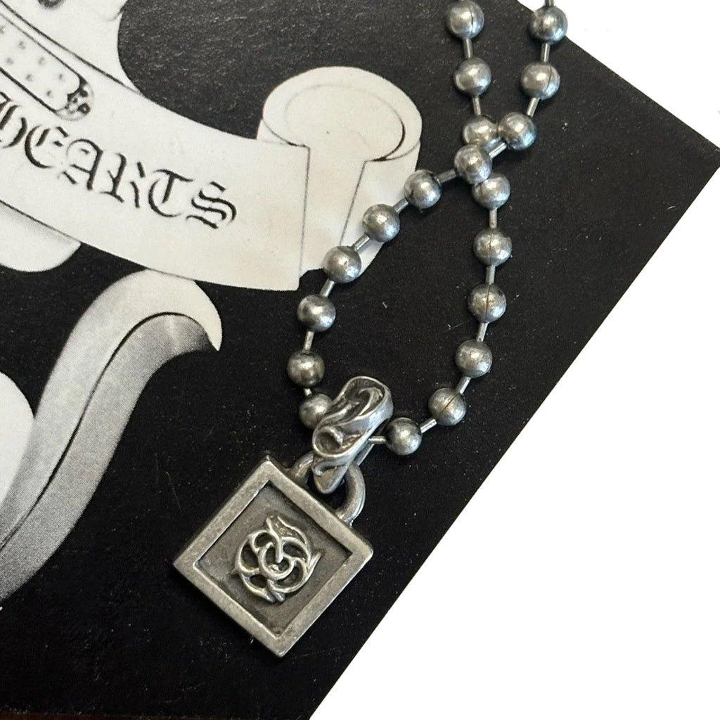 CHROME HEARTS FRAMED FLORAL PENDANT